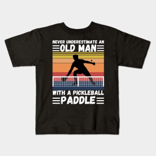 Never underestimate an old man with a pickleball paddle Kids T-Shirt